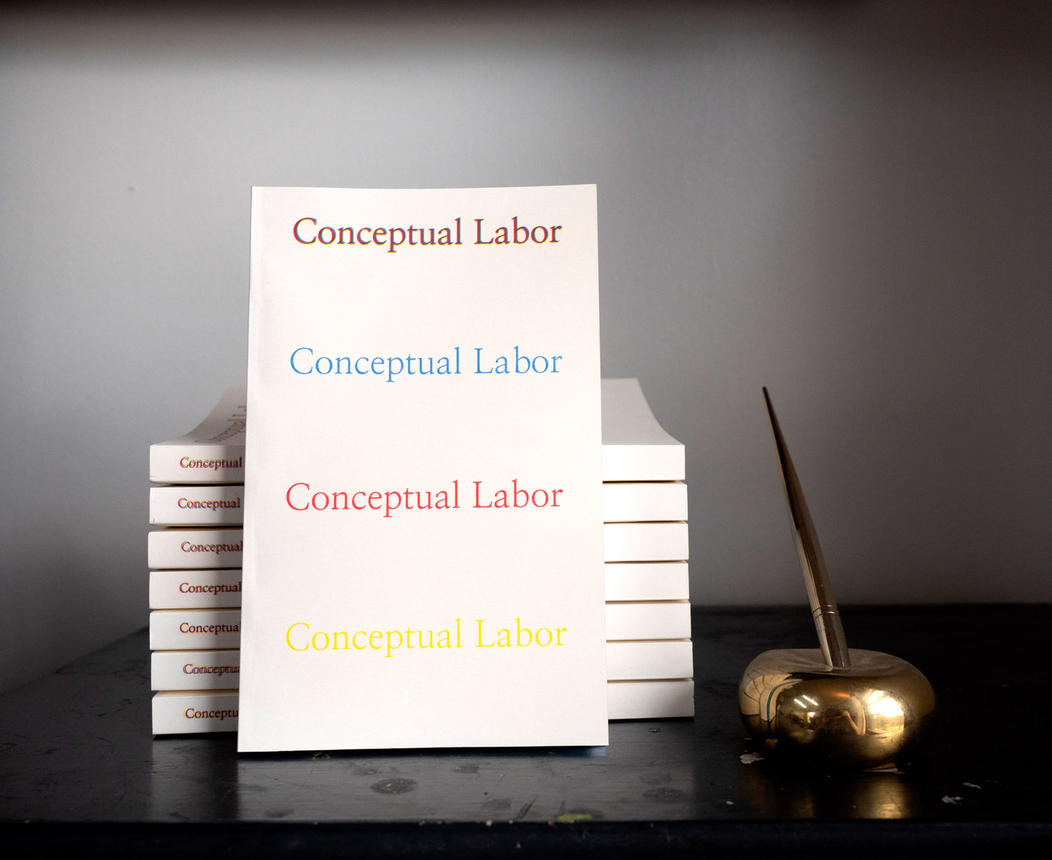 A Stack of paperback copies of Conceptual Labor